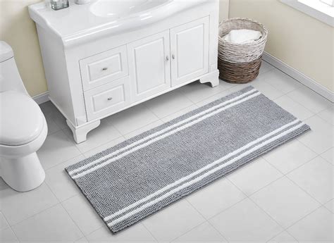 Machine tufted from 100% cotton with a lightly sprayed anti-skid back. . Bathroom runner 24 x 60